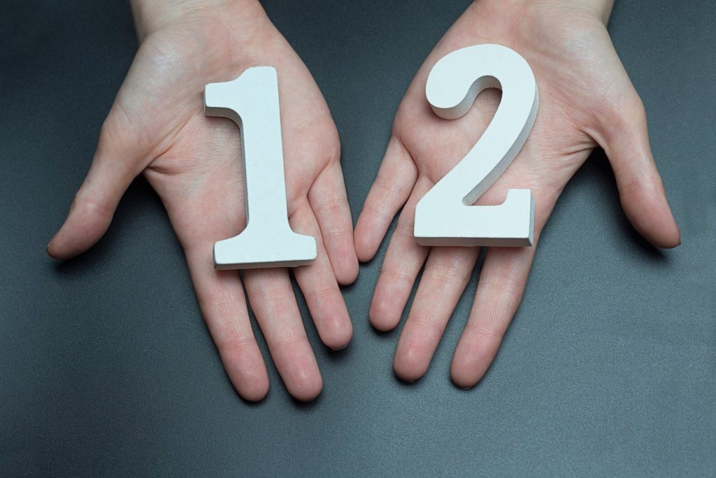 A man holds a number indicating the number of grounds for divorce